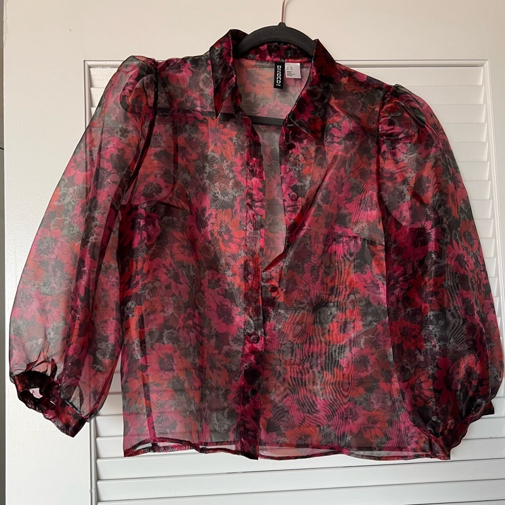 Black and pink floral sheer button down blouse.